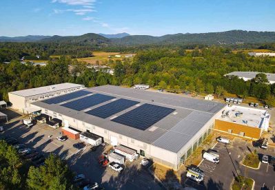 MANNA FoodBank Commercial Rooftop Solar with a view of the mountains