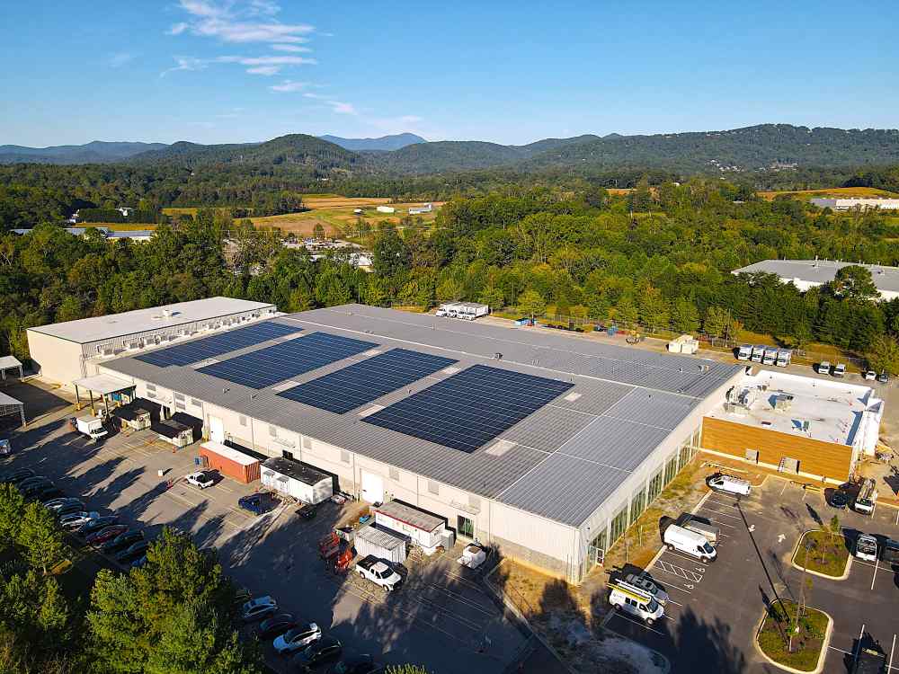 MANNA FoodBank Commercial Rooftop Solar with a view of the mountains